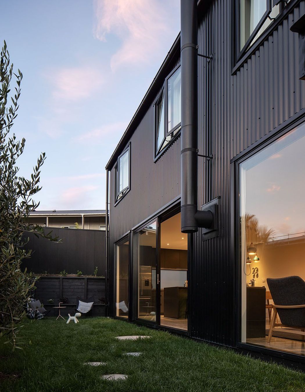 The side of the house connects with the ground-floor spaces.