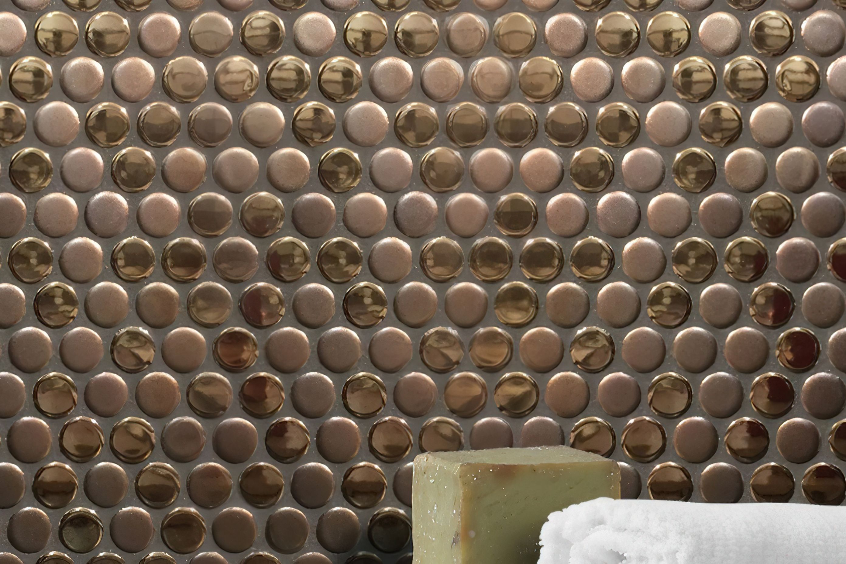 Pennyround tiles are an excellent choice for those looking to add a layer of texture in their design scheme. Our luscious Bling collection offers a rich combination of matt and glossy metallic finished pennyround tiles in your choice of copper or gold for the ultimate in luxury!