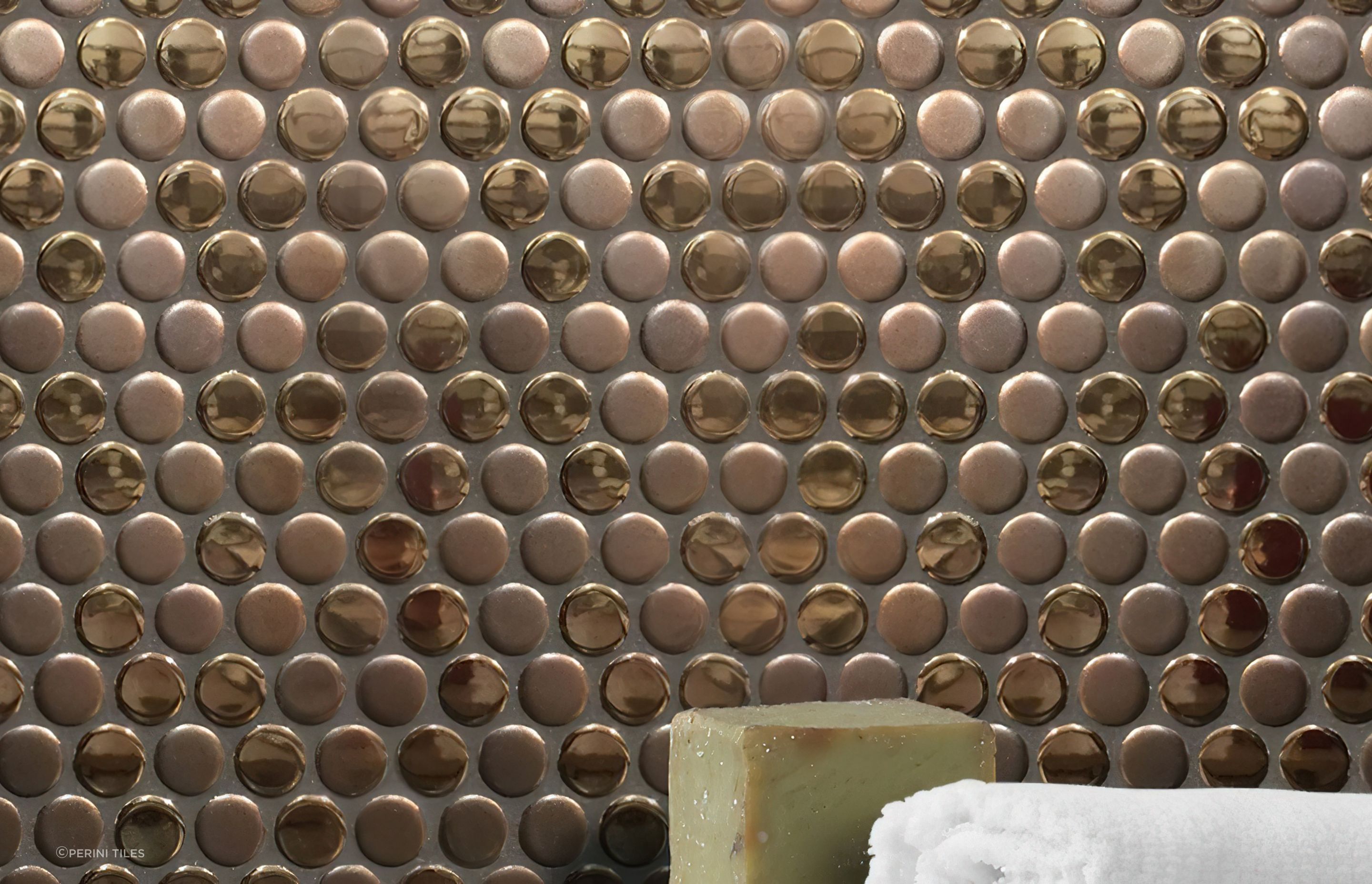 Pennyround tiles are an excellent choice for those looking to add a layer of texture in their design scheme. Our luscious Bling collection offers a rich combination of matt and glossy metallic finished pennyround tiles in your choice of copper or gold for the ultimate in luxury!