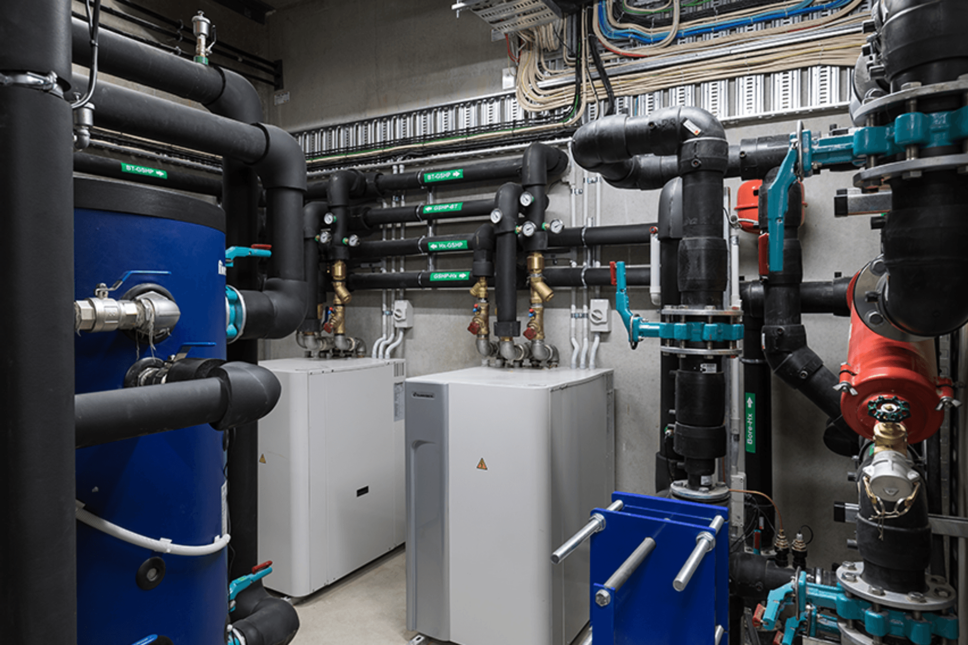 Cosgroves designed and installed a mechanical and hydraulic solution for Blum that includes a perimeter trench heating system fed via an open loop ground-source heat pump system, as well as a natural ventilation system controlled by an automated weather s