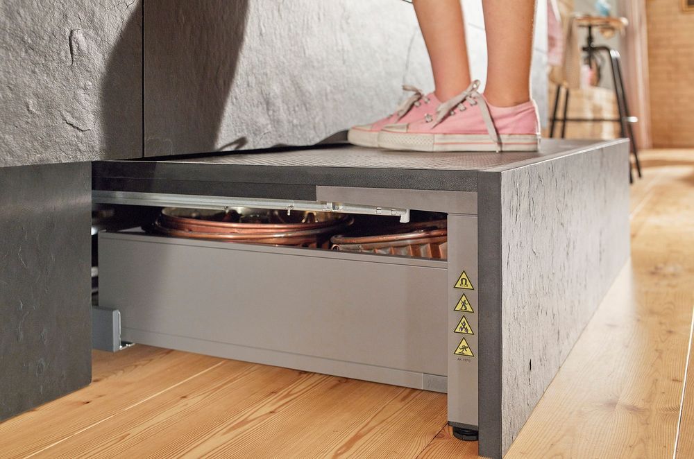 An easily accessible area for additional storage, the Space Step sits concealed behind the toe kick.