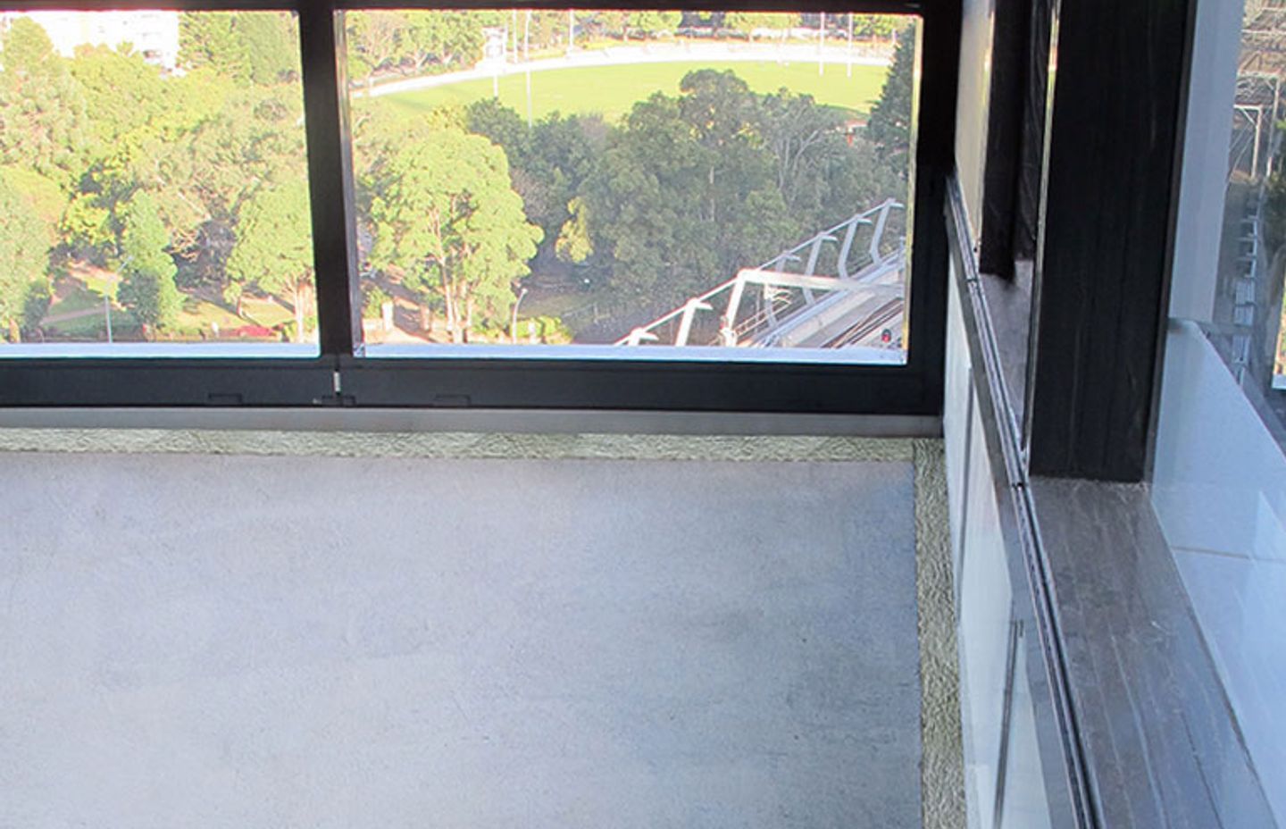 Curtain wall batts installed at slab edge