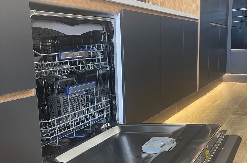 Hidden SMEG dishwasher with cabinet front attached to the exterior of the dishwasher in our kitchen showroom in Auckland