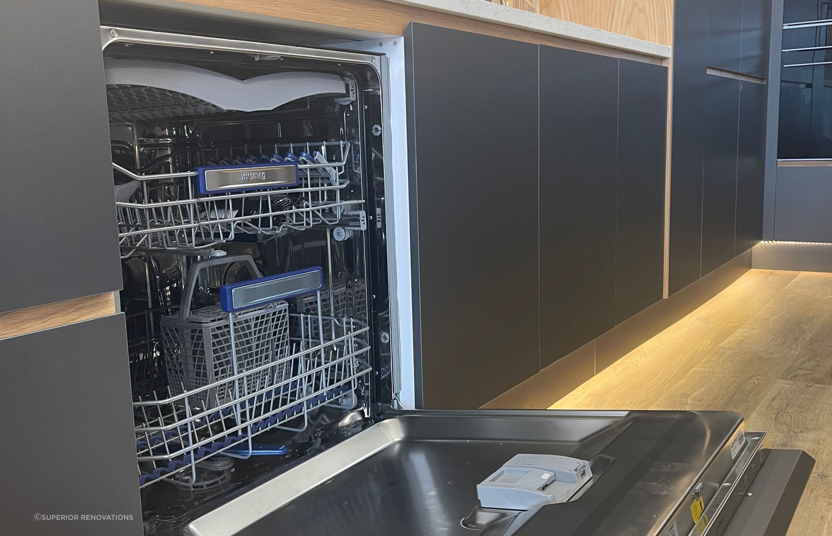Hidden SMEG dishwasher with cabinet front attached to the exterior of the dishwasher in our kitchen showroom in Auckland