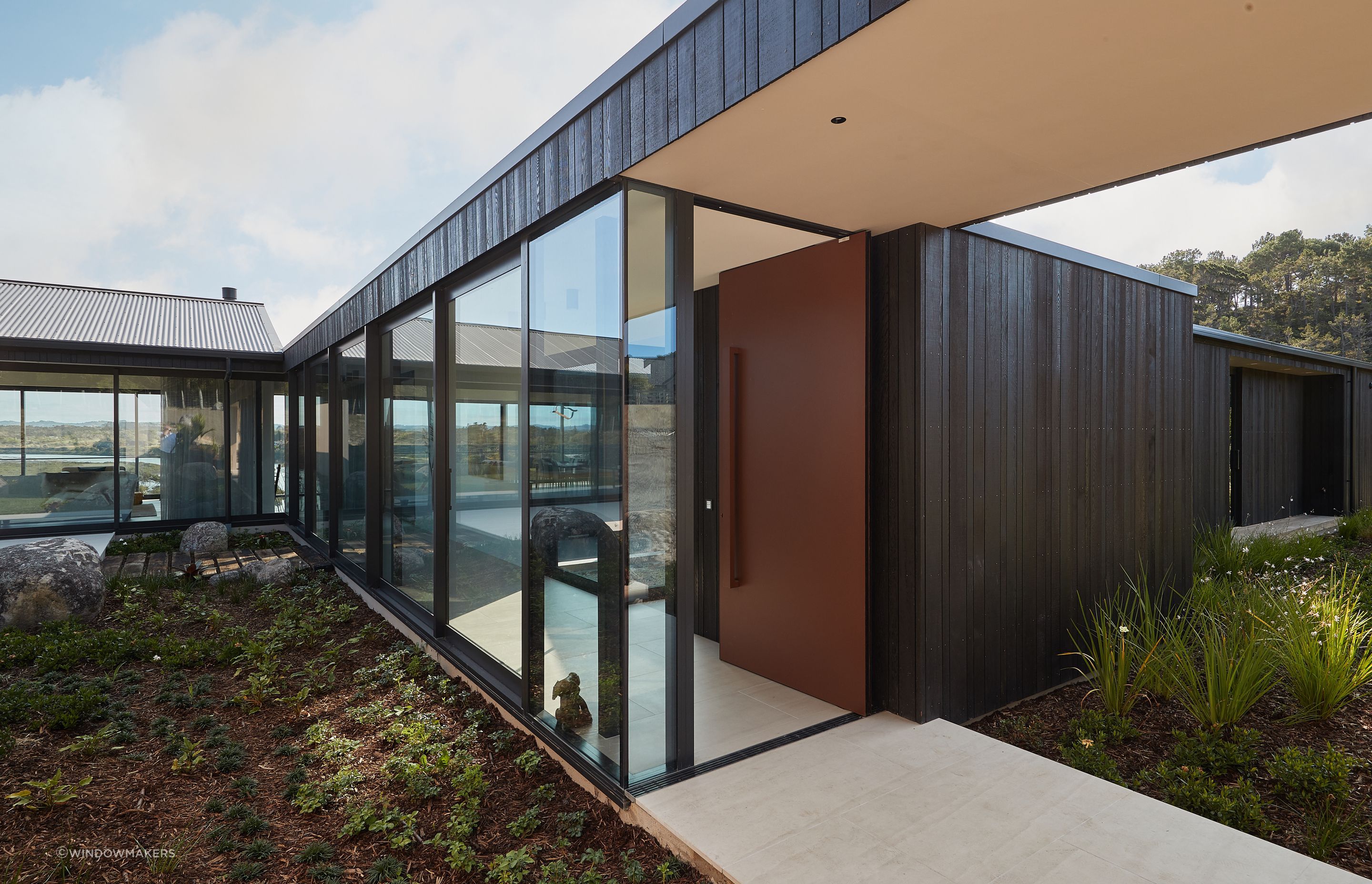 This Plasma Entrance Door made from flat sheet aluminium adds a modern, industrial edge to this home