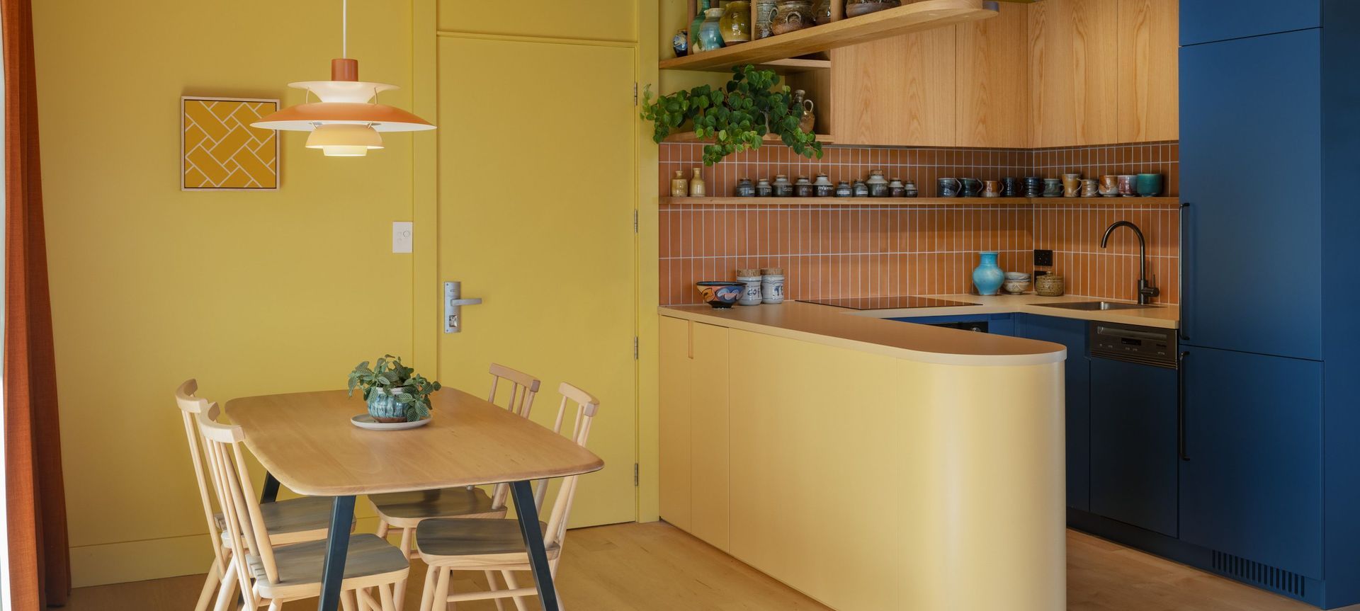 Interior Design and Architecture by Chris Corson-Scott and Pac Studio – All Purpose Chair and Plank Table by Lucian Ercolani for L. Ercolani. Pottery on the overhead shelf by Andrew Van Der Patten