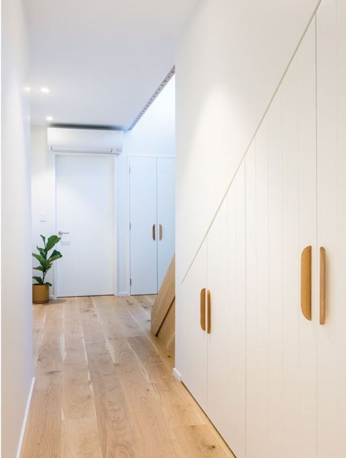 NATURAL WARMTH Engineered wooden flooring in the living areas and woollen Bremworth carpets in the bedrooms are from The Flooring Centre.
