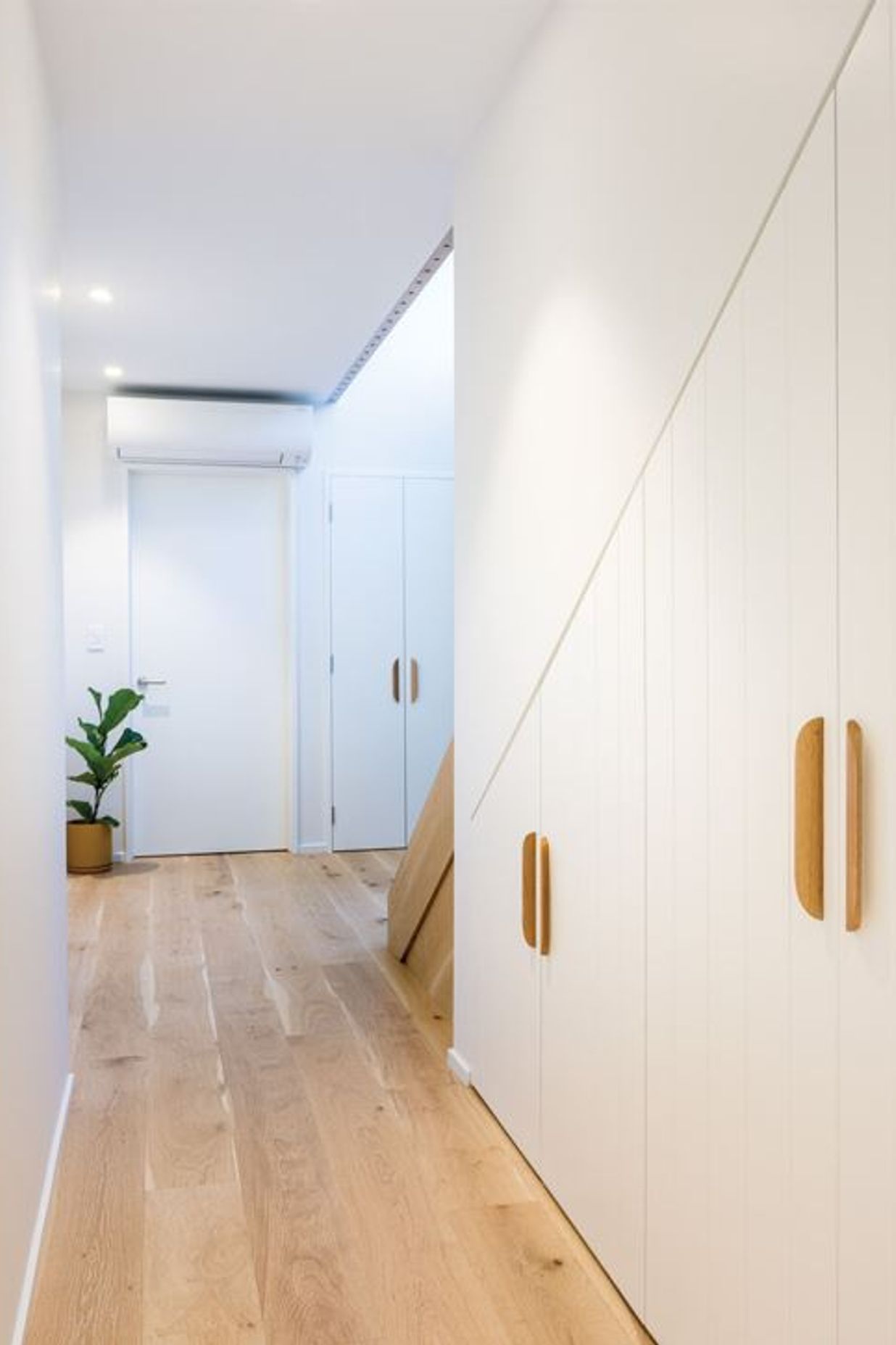 NATURAL WARMTH Engineered wooden flooring in the living areas and woollen Bremworth carpets in the bedrooms are from The Flooring Centre.