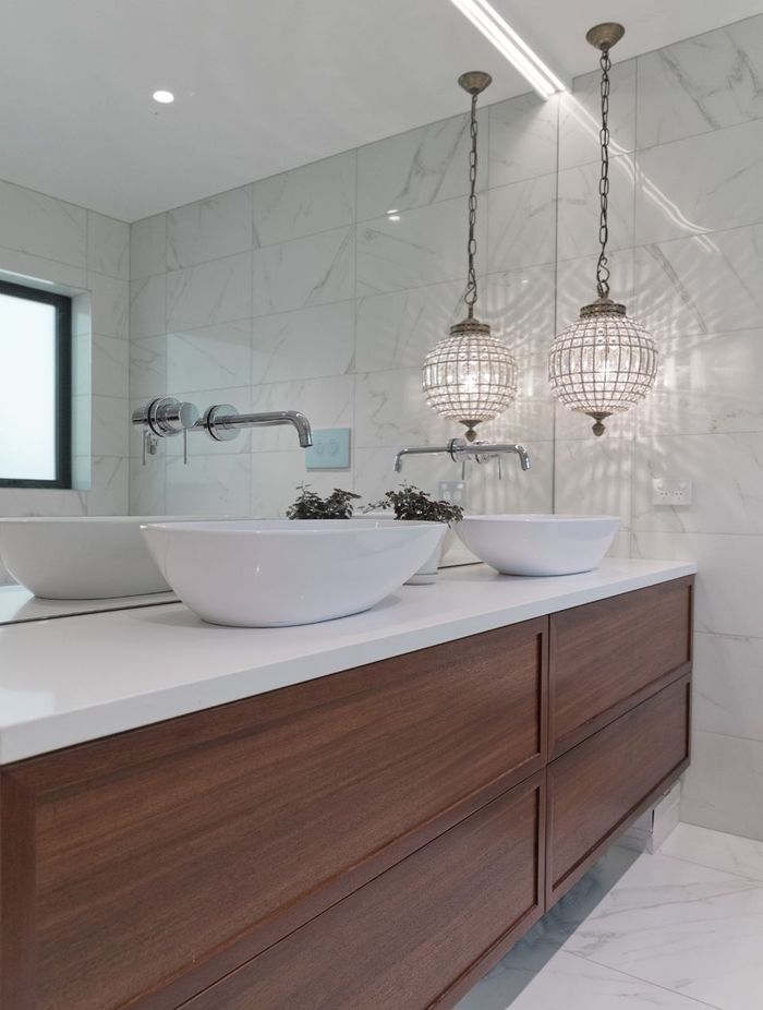 Siobhan and Andrea worked closely with the homeowners of this project. A beautiful materials palette of marble and timber was chosen for throughout the home, with pops of colour added in the master bedroom, entrance and lounge to enhance the client's personal art collection.