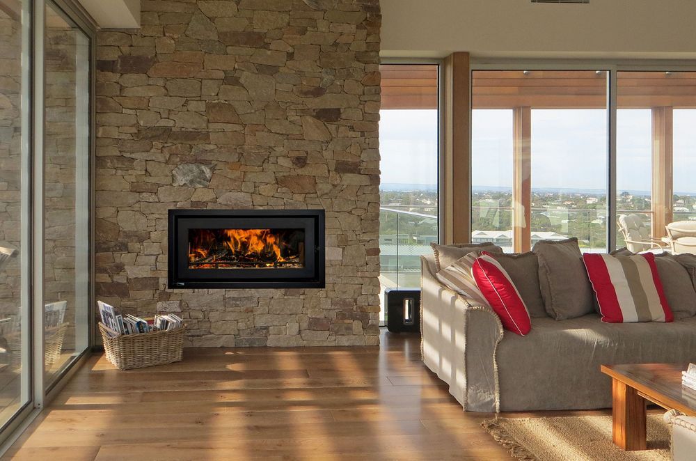 The simple elegance and sleek lines of the Kemlan Celestial 900, with the stunning natural stone feature wall.