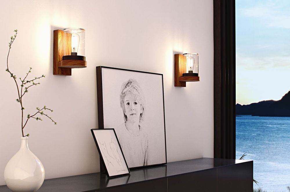 Your side walls are a great spot for lights like the Cloche Wall Light by Royal Botania