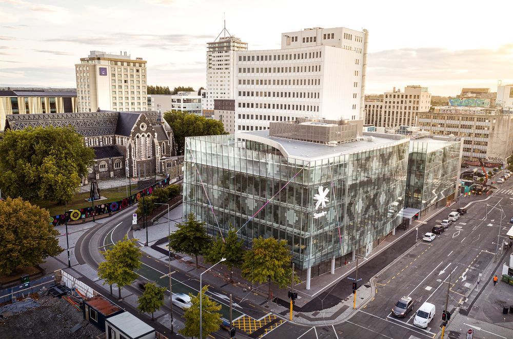 A contextual view of 2 Cathedral Square, showing the patterned glazed facade in relation to the patterned slate roof of ChristChurch Cathedral. Photograph: Dennis Radermacher/Lightforge.
