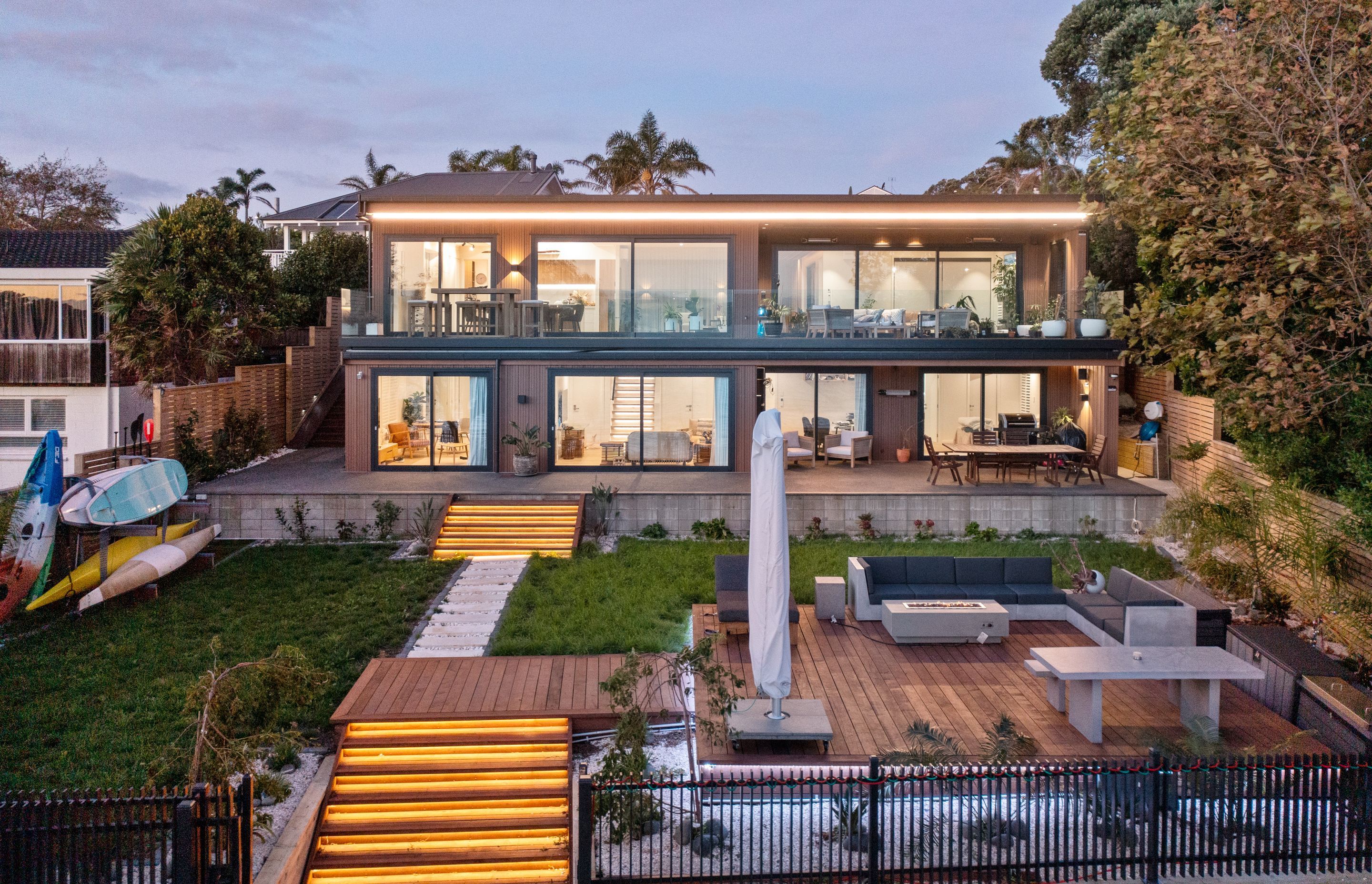 Recessed strip lighting was installed on the steps and around the deck to illuminate the entertainment area.