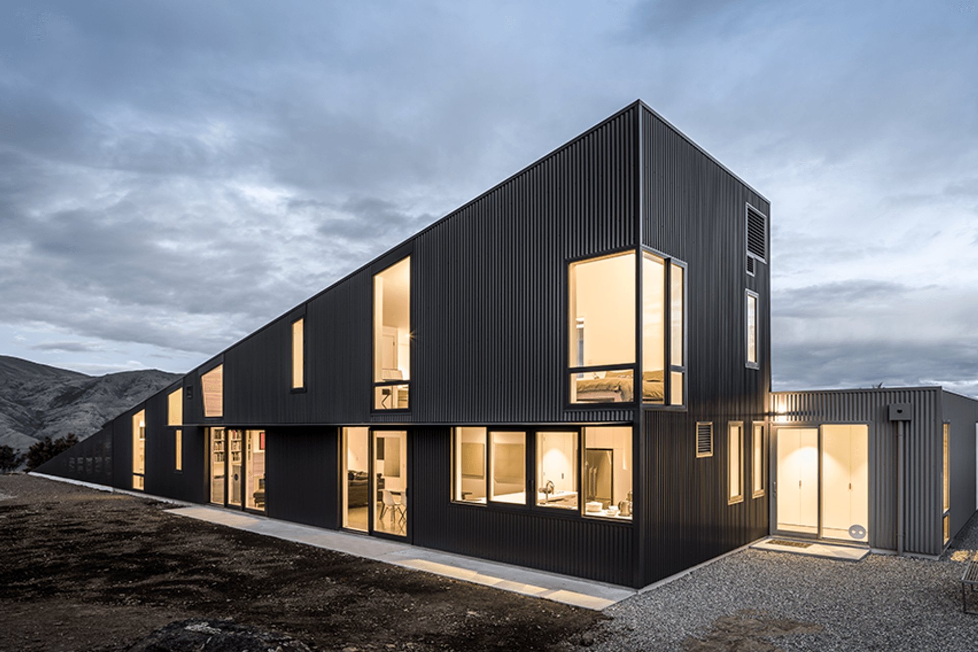 Dimond Roofing Corrugate in Black and Grey Friars was specified for this Wanaka house. Installed by RoofingSmiths.