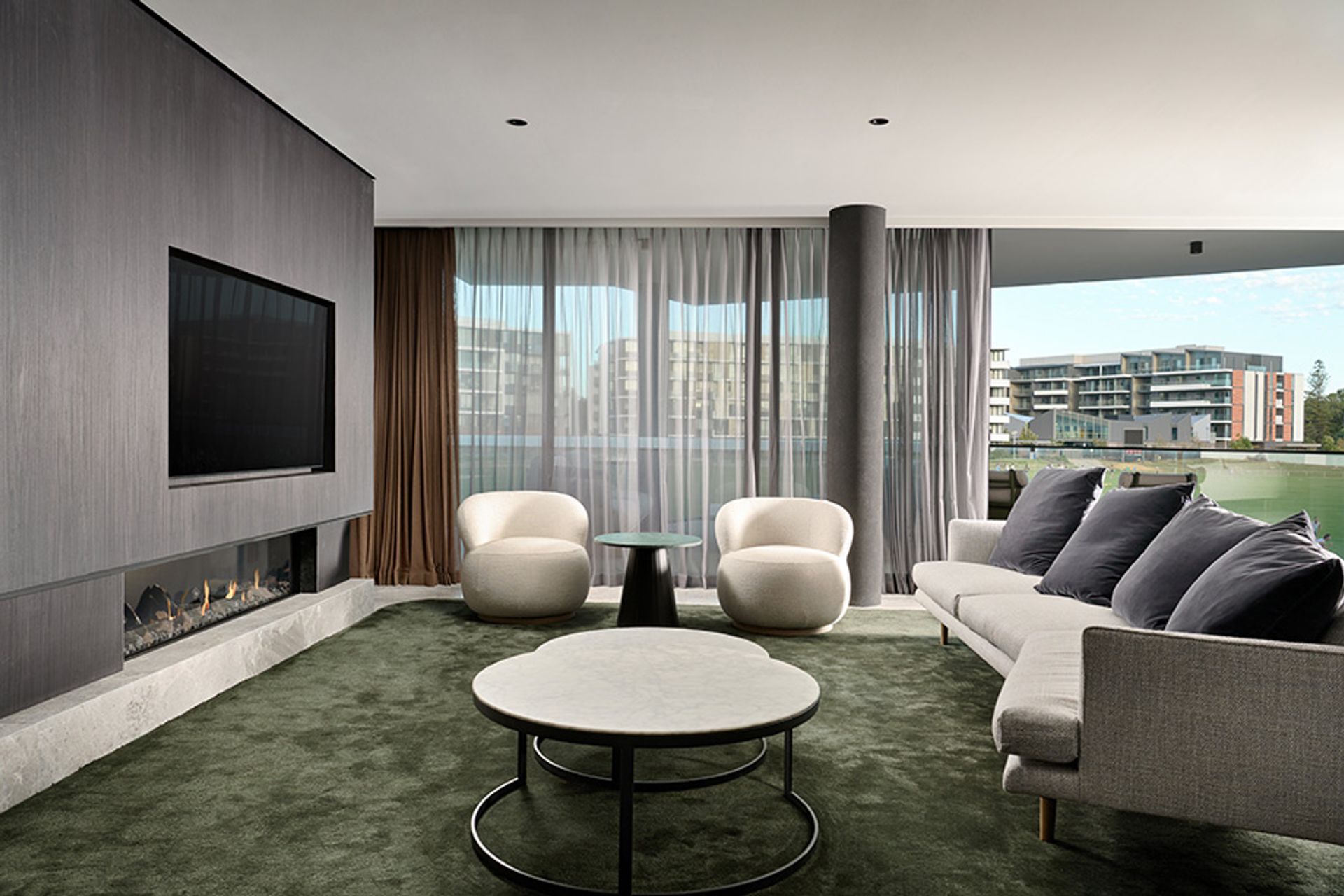 The frameless Escea DS1650 gas fireplace installed in the living room of a Lucent Claremont Apartment by Hillam Architects. Photography: Joel Barbitta.