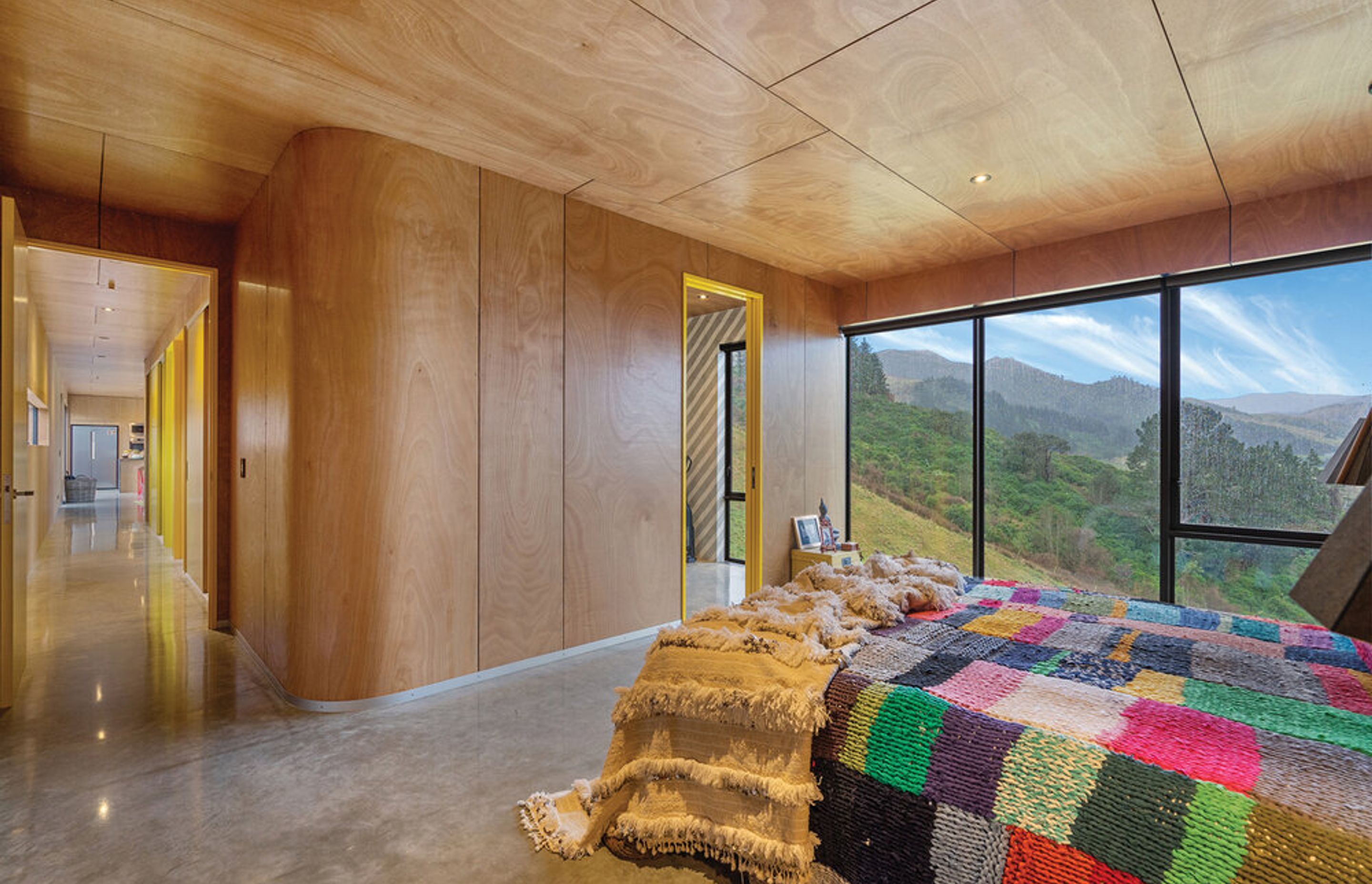 The plywood interior cladding represents the flower's woody pod and the white American oak joinery complements the okume plywood beautifully.