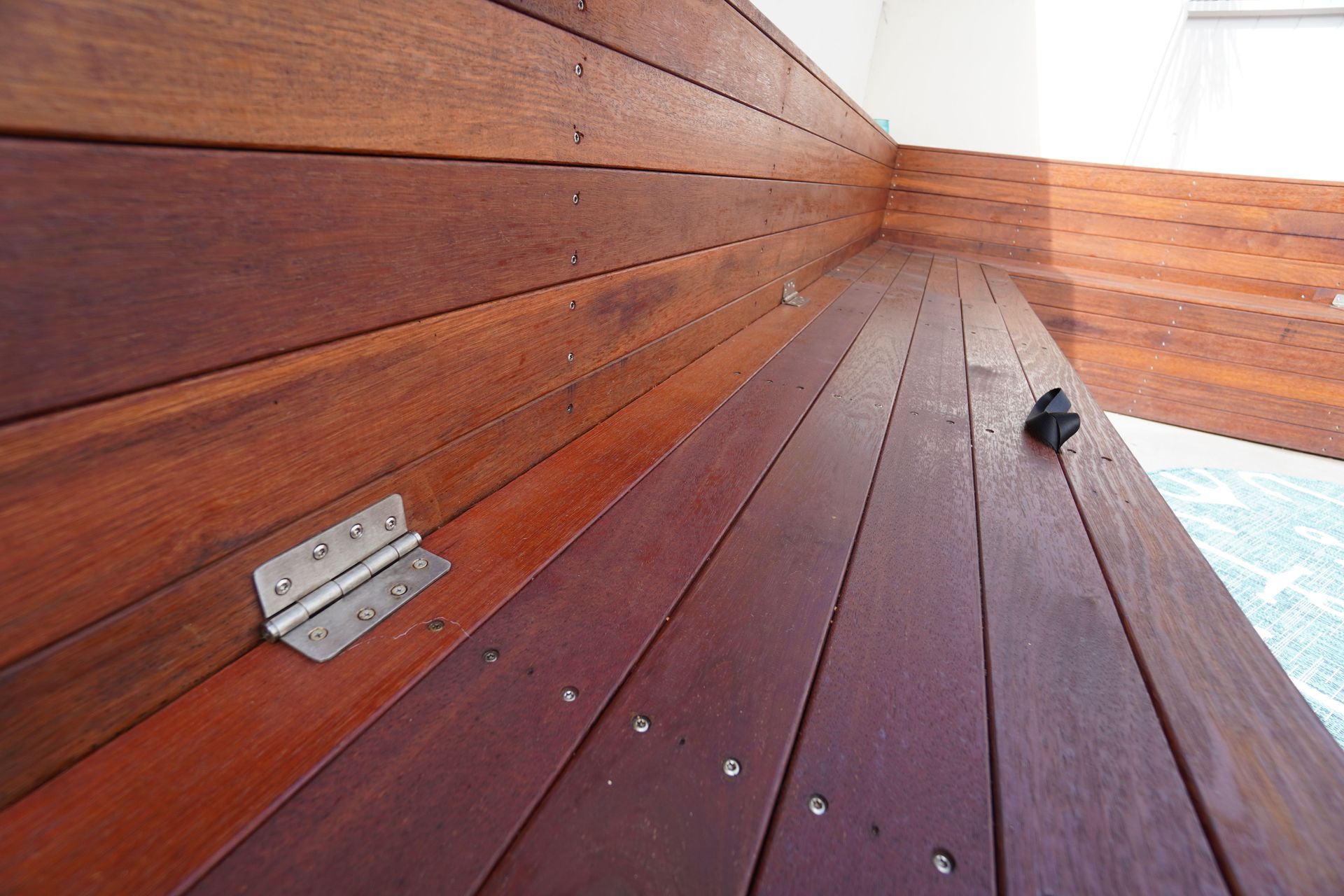 As seen in the picture, the benches have storage within them to store all outdoor accessories.