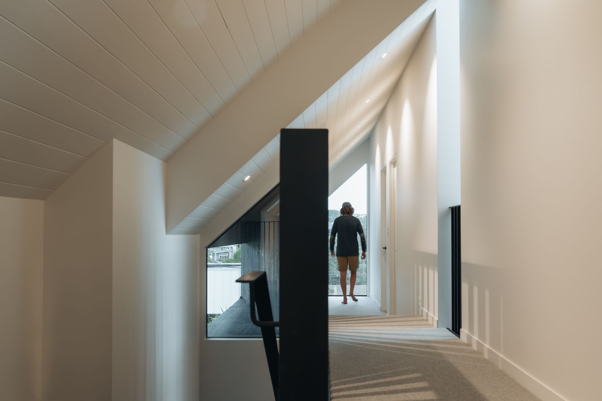 The top storey of the home makes the most of available space with the hallway tucked into the slant of the gabled roof.