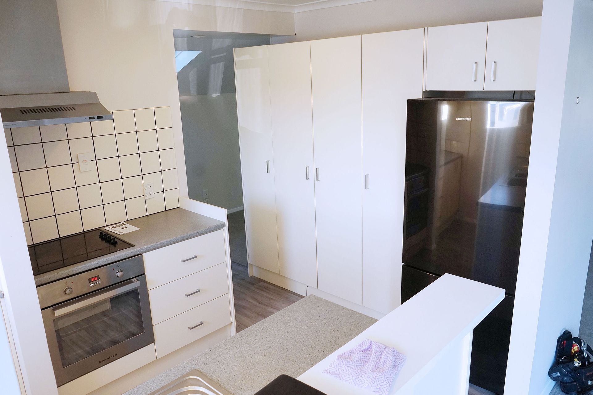 BEFORE the wall was demolished between the kitchen and lounge