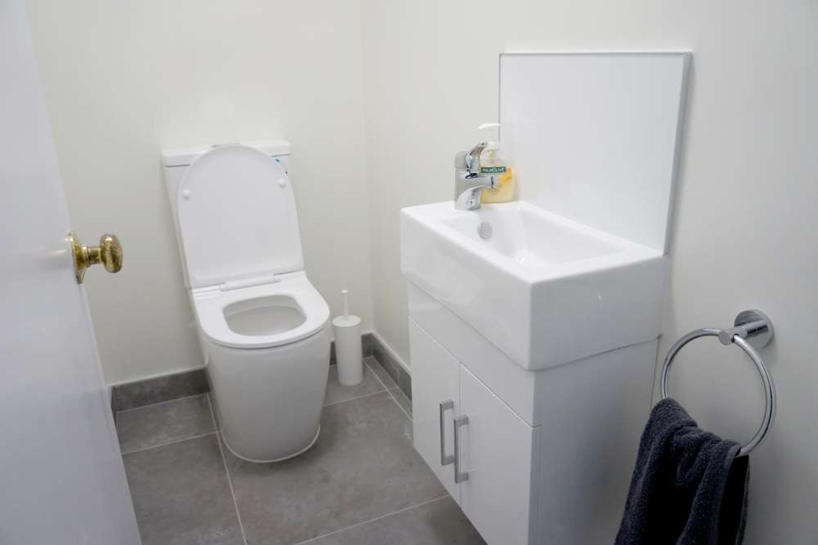 600 by 600 tiles used in this small powder room