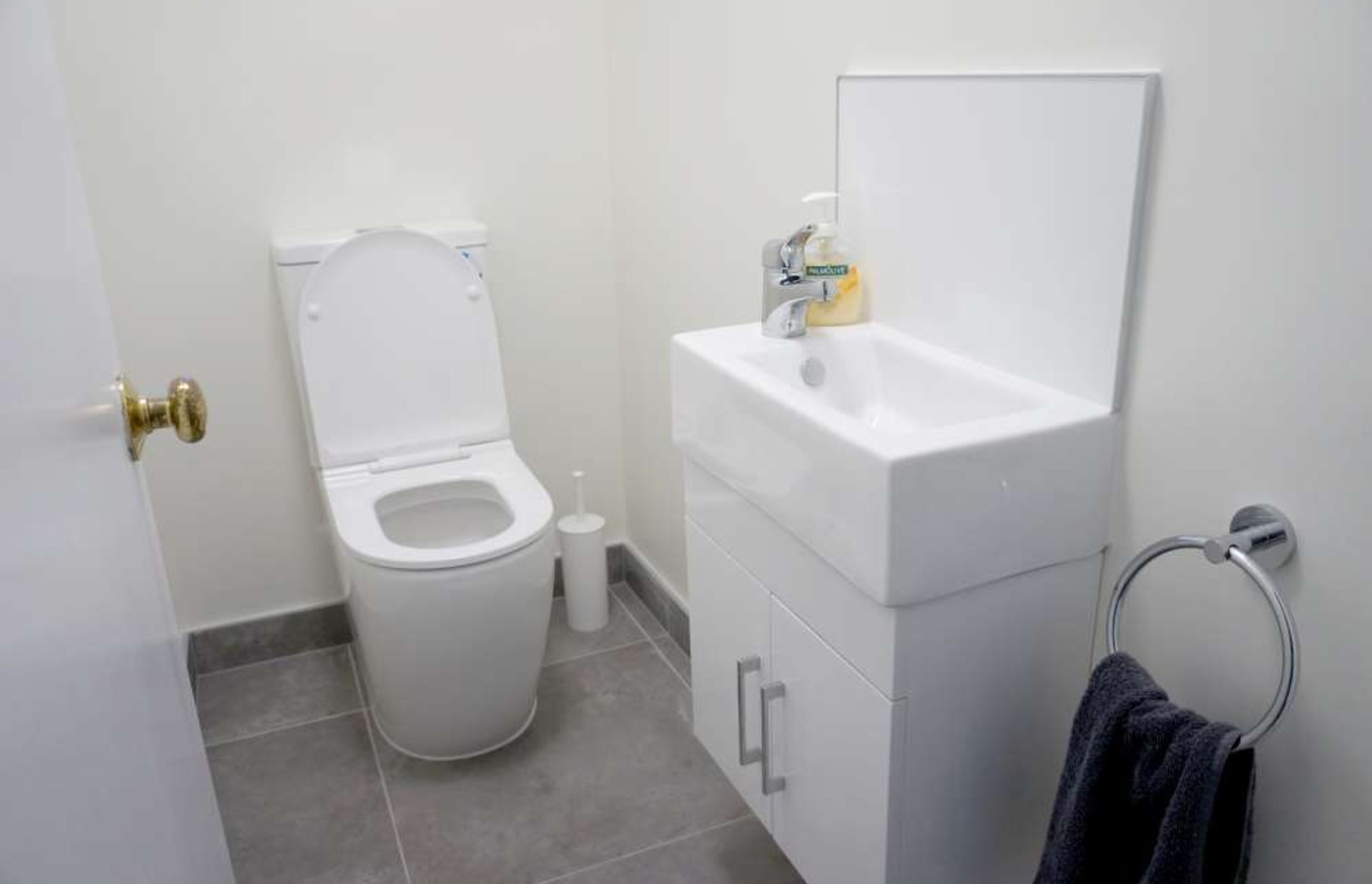 600 by 600 tiles used in this small powder room