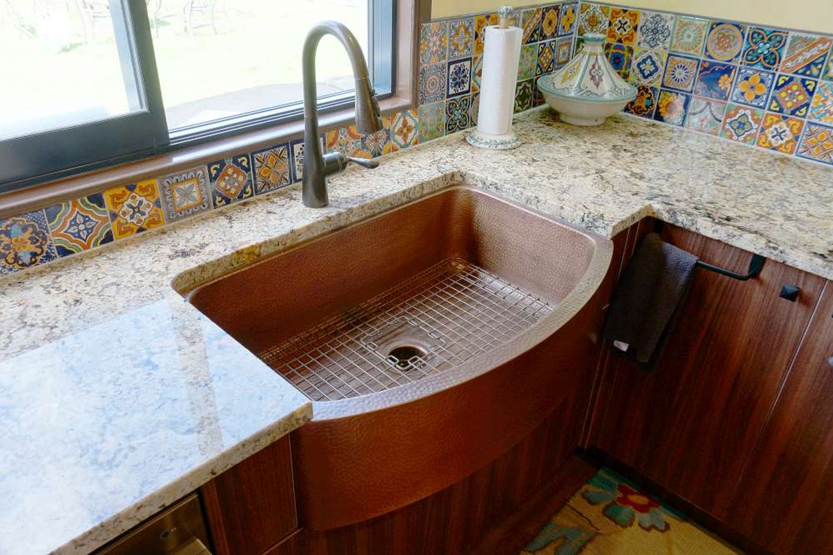 Brass sink and dull brass tap used to make the kitchen look rustic yet traditional