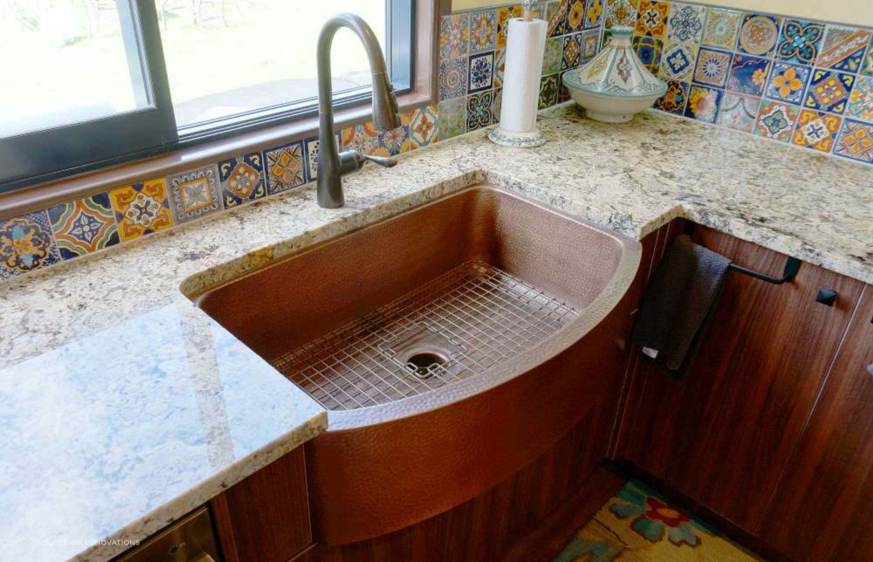 Kitchen renovation in Stanmore Bay: Textured Brass sink and tap fixtures added metal elements to this kitchen in Orewa.
