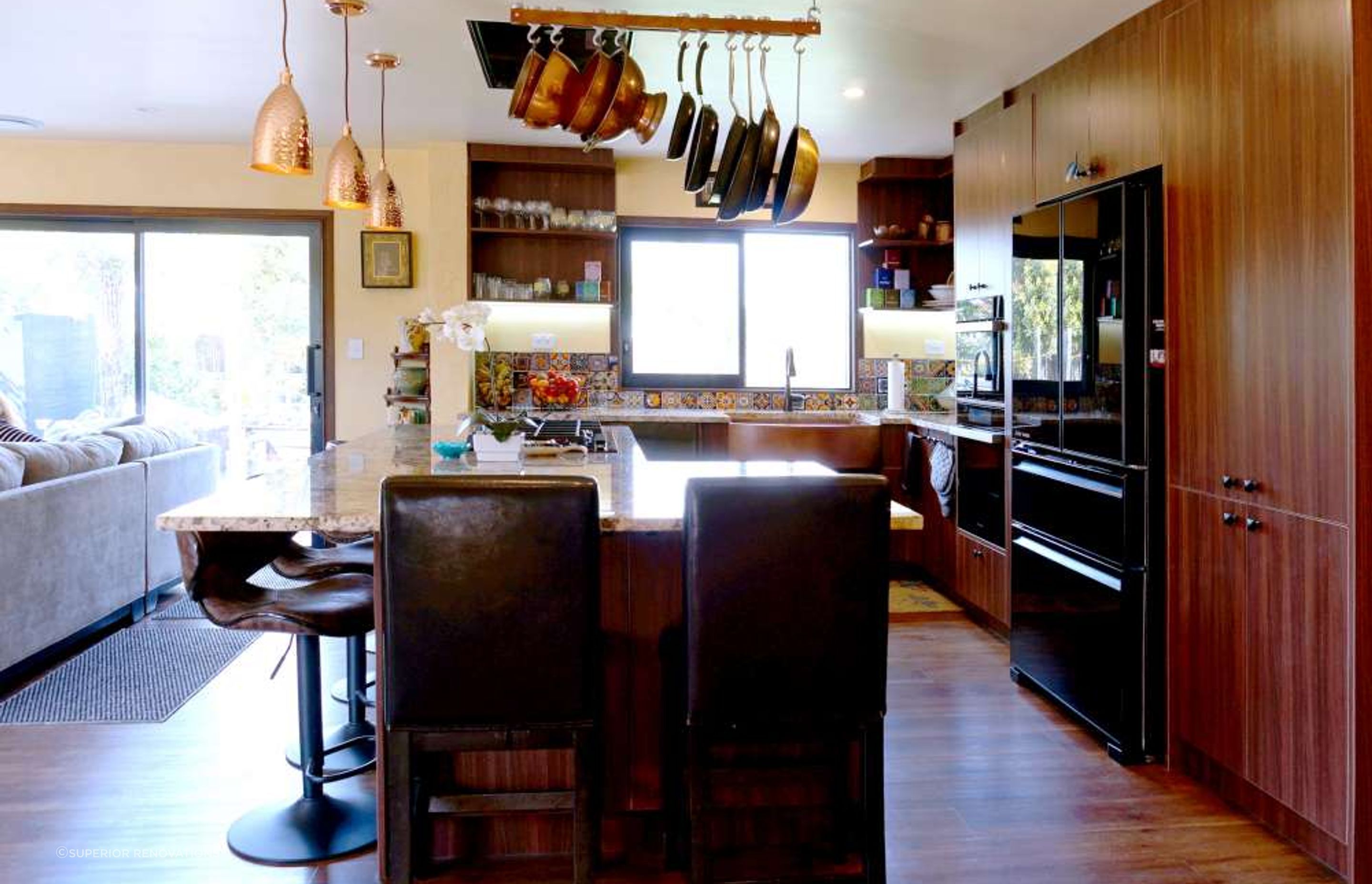 AFTER the kitchen was renovated. The wall between the kitchen and living room was demolished to create an open living space.