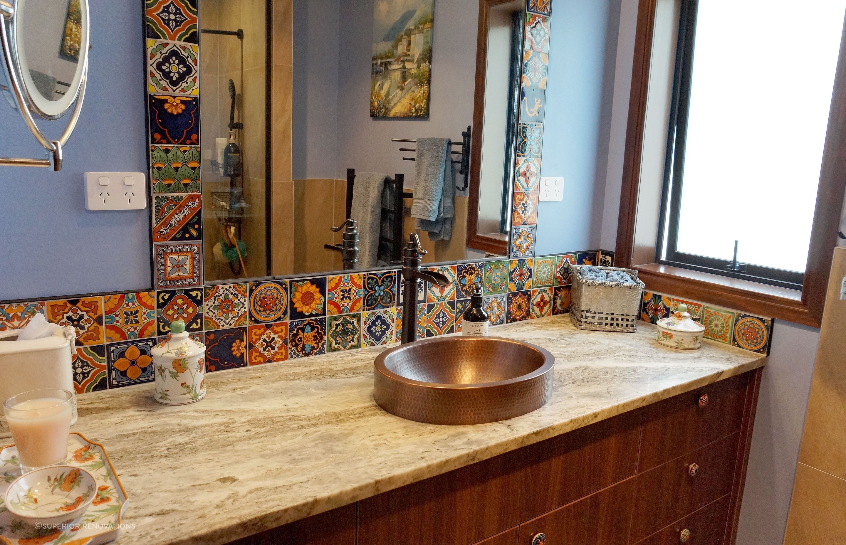 Spanish style mosaic tiles and brass gold sink