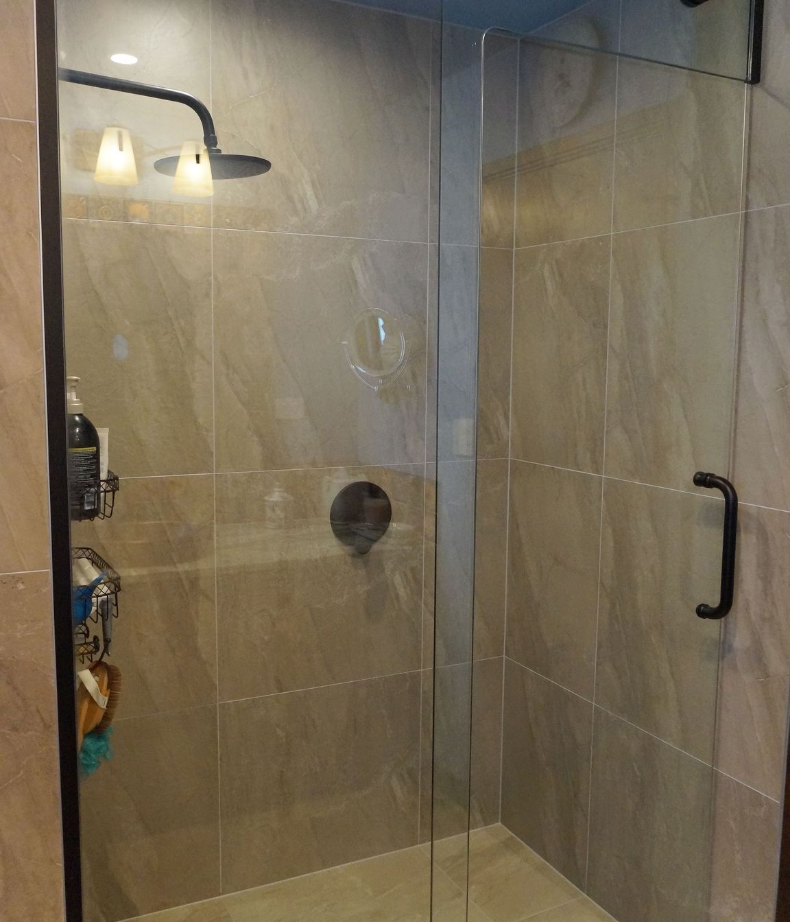 This tiled shower was renovated with a floor to ceiling glass door to make the bathroom look more open and spacious – Bathroom renovation in Stanmore Bay, Auckland