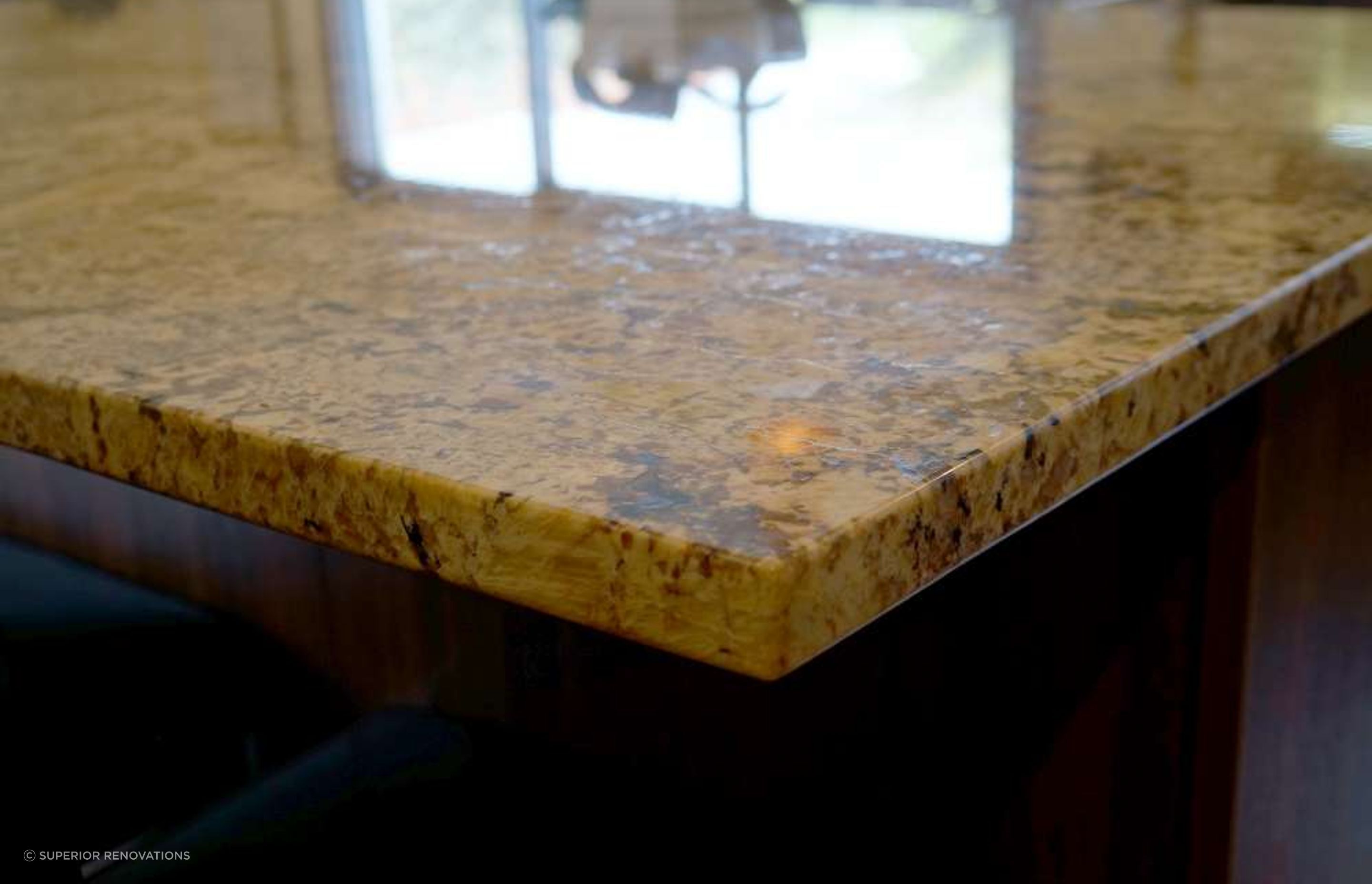 Kitchen renovation in Stanmore Bay: Engineered stone used to look like pattered granite. The pattern chosen by our client was Autumn Leaf. 