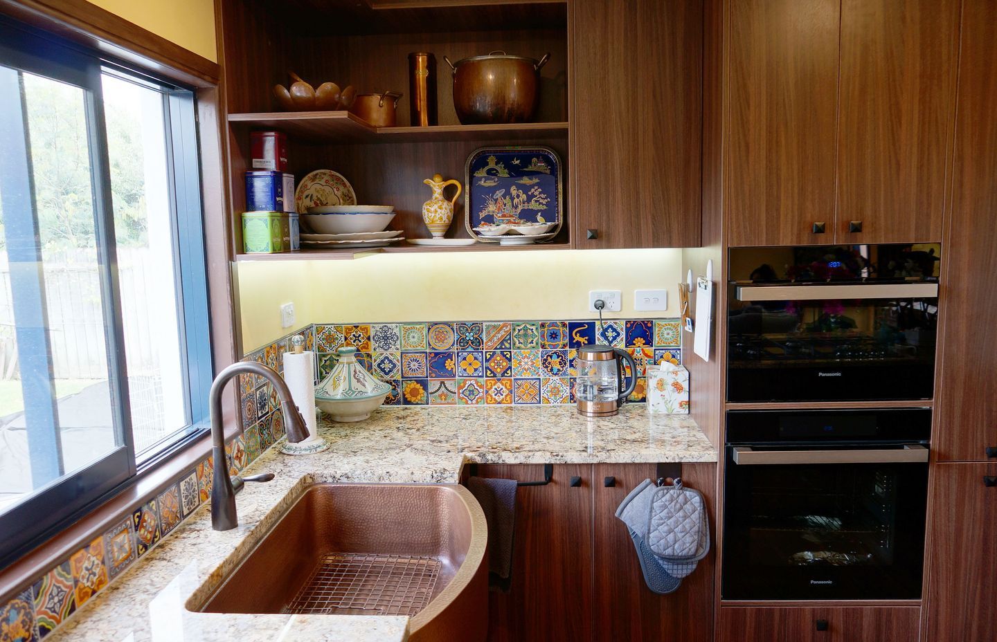 Kitchen renovation in Stanmore Bay: The Spanish tiles installed in this kitchen are a great design element that can be used to enliven a space.