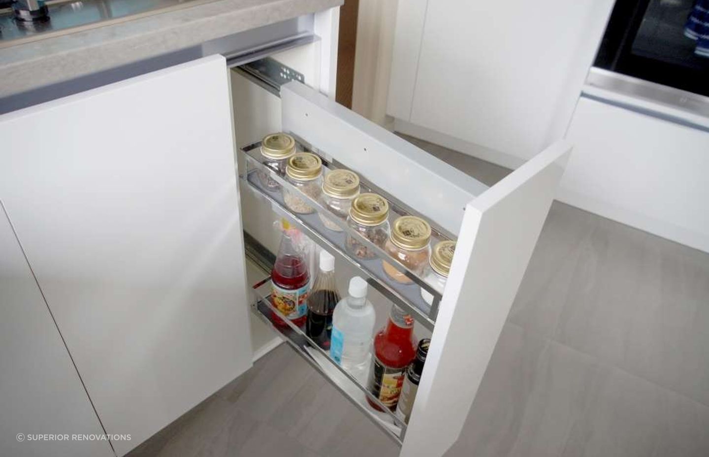 
 Custom built storage solution for cabinets to store condiments.