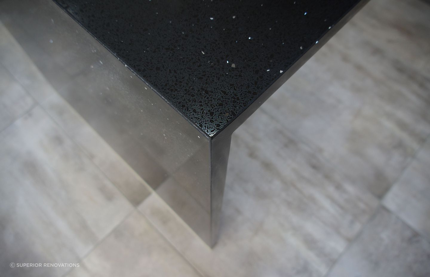 Kitchen renovation in Bucklands Beach: We engineered stone to look like black marble which was then infused  with shiny specs to add a touch of luxury for this kitchen renovation.