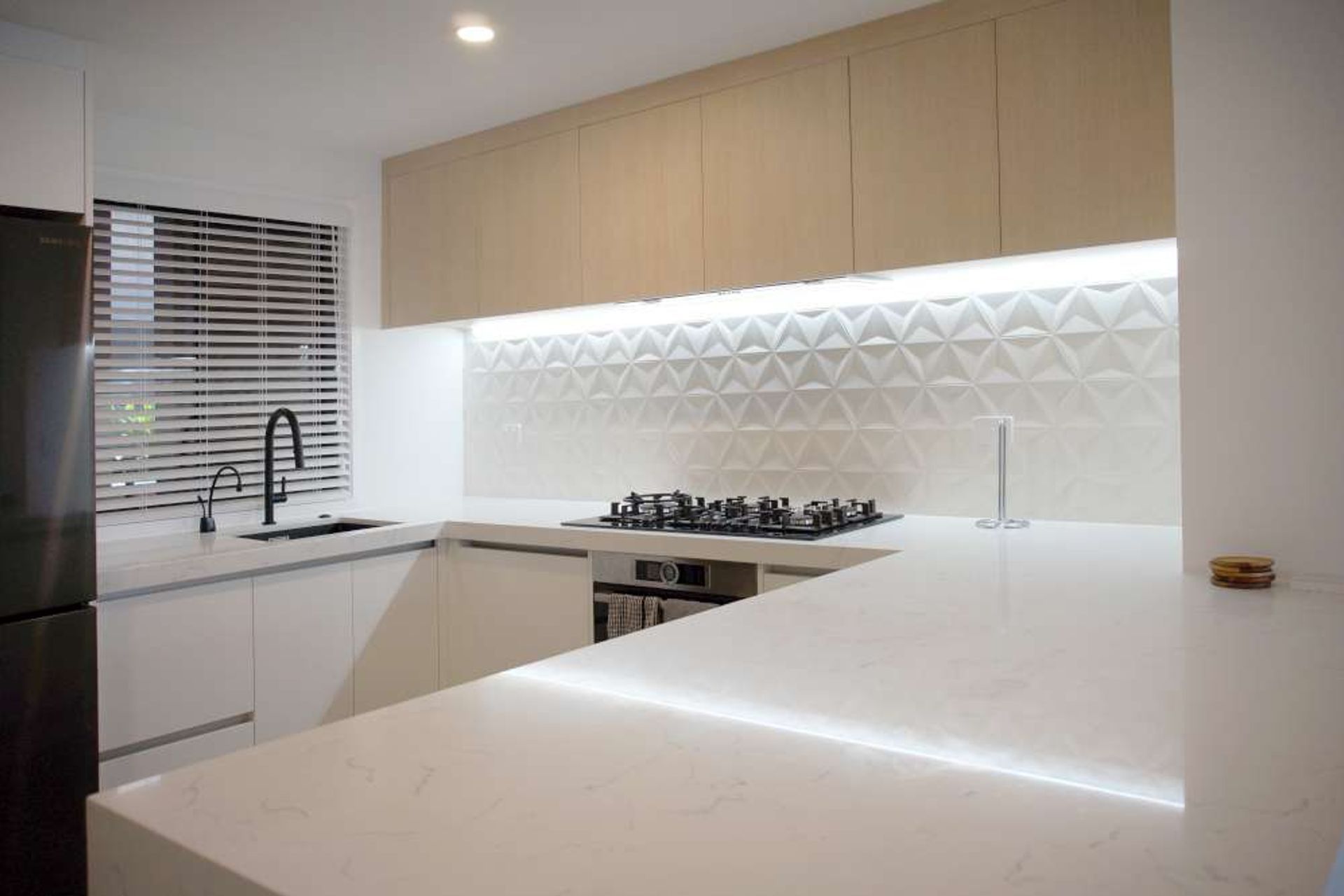 AFTER we renovated the kitchen. We moved the kitchen from the left to the right side of the room.
