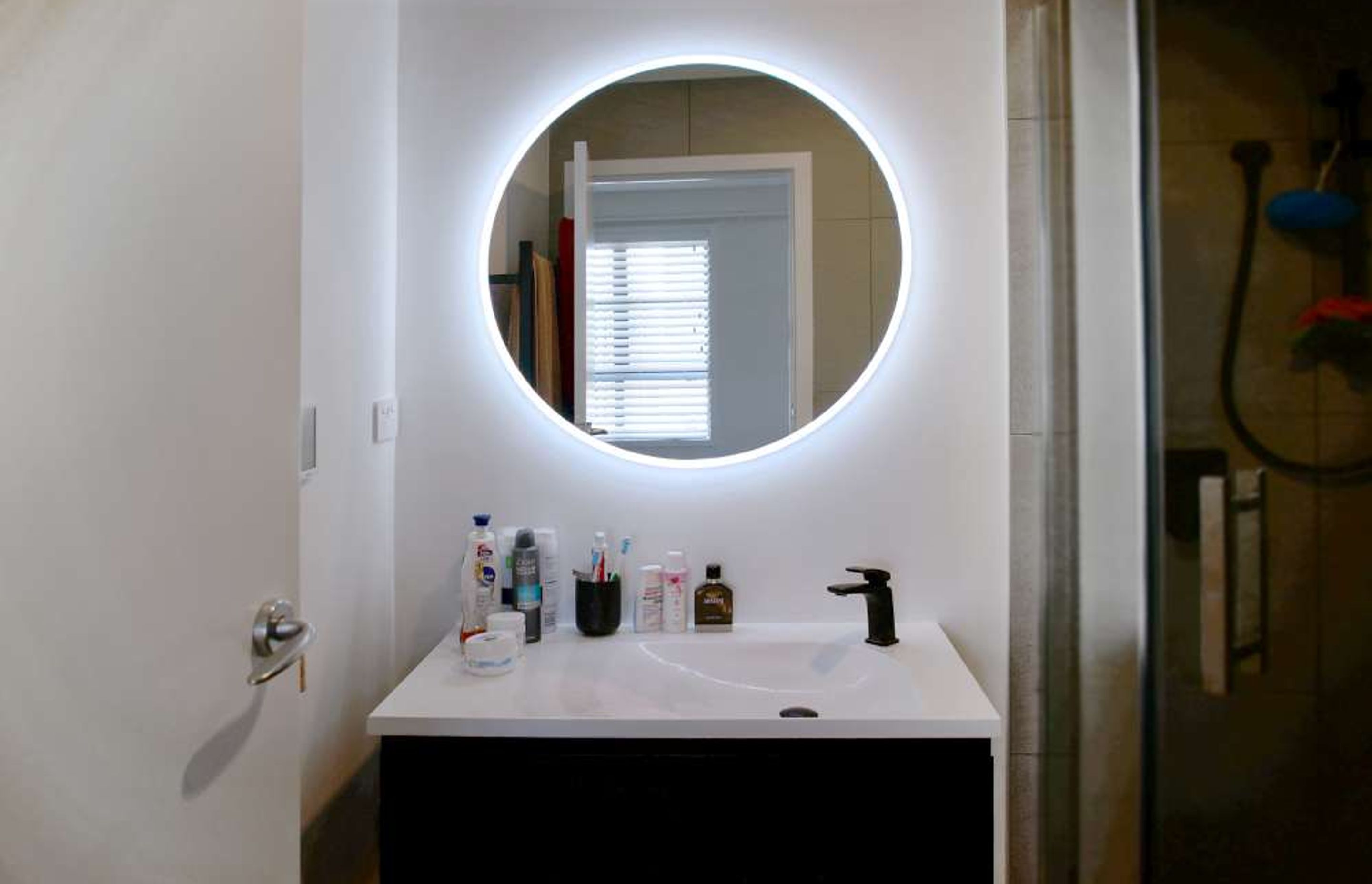 This bathroom renovation in Parnell was renovated to make it look luxurious and modern which was in line with our client’s urban lifestyle. The mirror installed had an LED anti-fog mirror with a touch button on it. The black floating shelves with sleek li