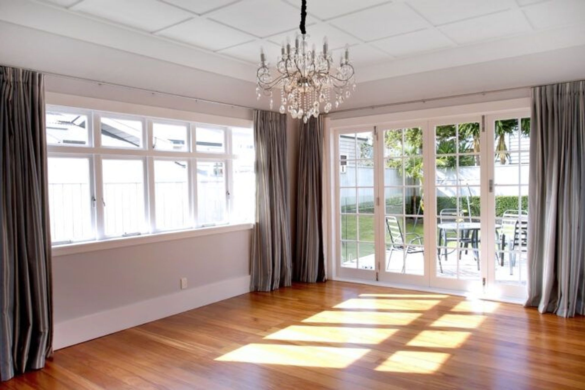 Beautiful French doors against the restored wooden floors