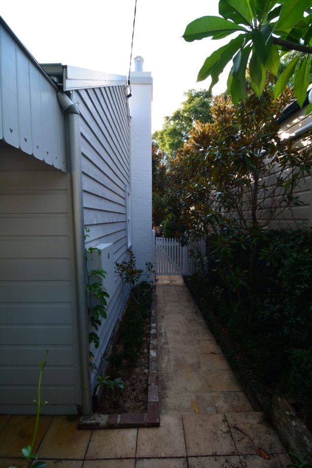 Re-using the original weatherboards after insulating the front section of the house greatly reduced the footprint of the total renovation.