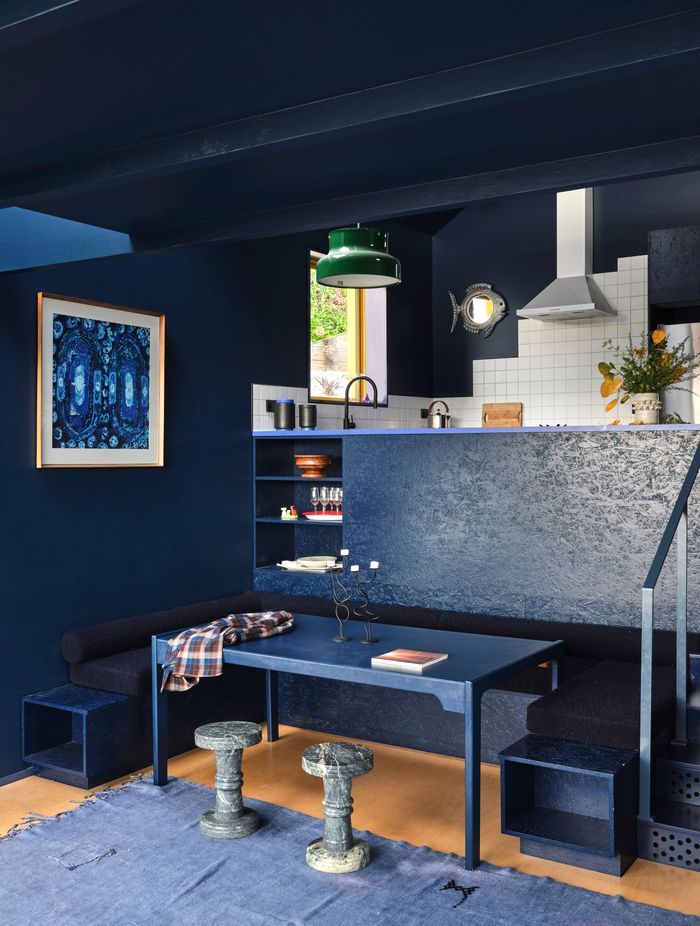 The booth seating in the dining nook was made by Fieldcraft and the table was a Trade Me find. “Everything’s the same colour, but we're using texture as the vehicle to move through the space,” says Natalie.