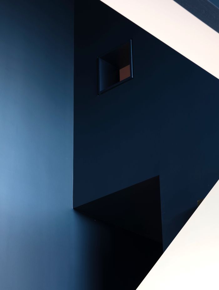 “In the kids’ bunkroom, there’s a ladder up to a third bunk that’s really super vertical. You have this tiny little window that looks back into the kitchen and living space, so you have these secretive, playful little moments,” says Dominic.