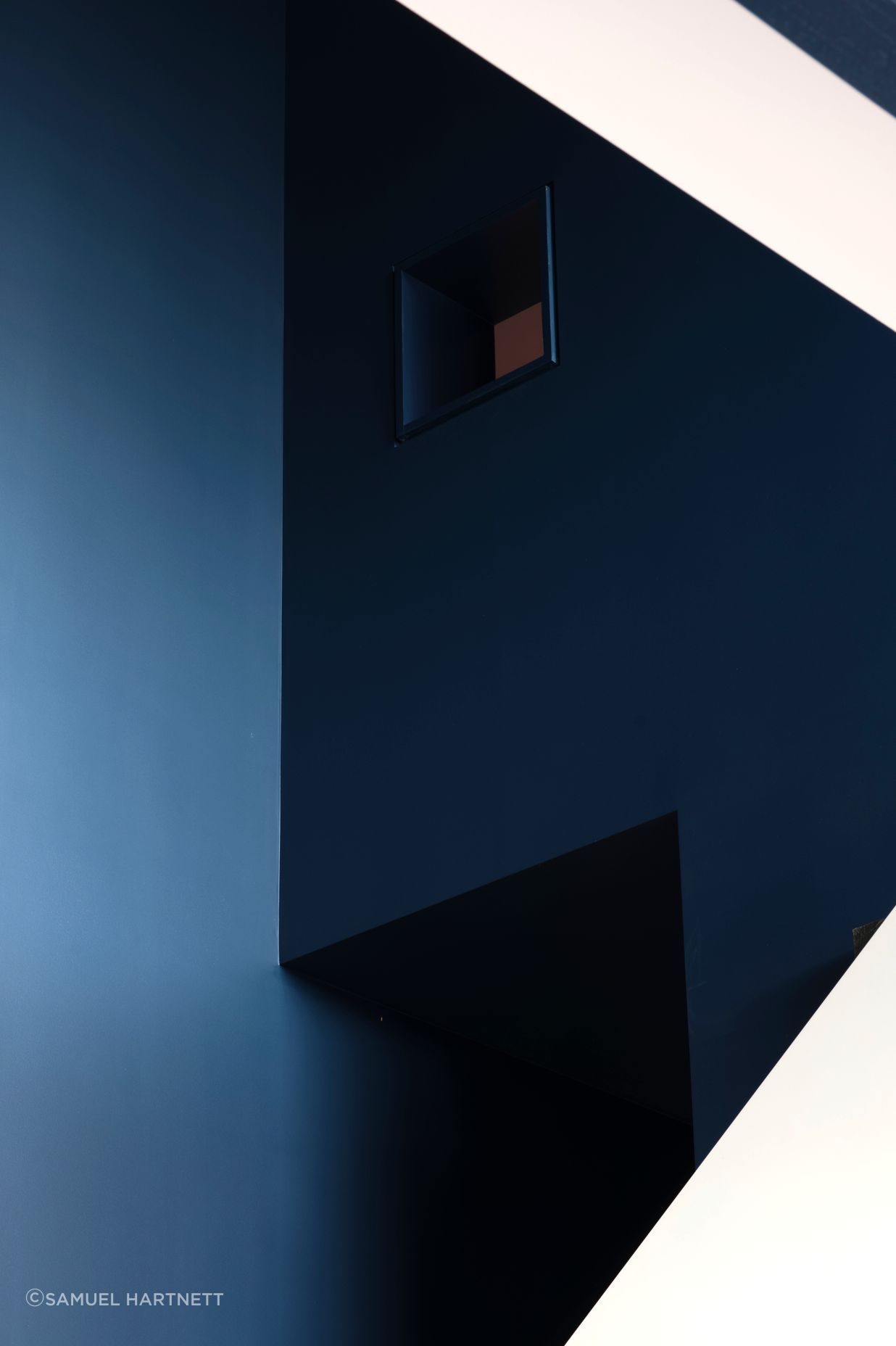 “In the kids’ bunkroom, there’s a ladder up to a third bunk that’s really super vertical. You have this tiny little window that looks back into the kitchen and living space, so you have these secretive, playful little moments,” says Dominic.