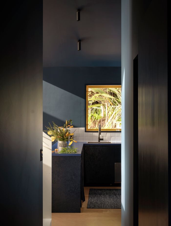 Formica finishes and curtained cupboards in the kitchen add to the bach feel. “When I create a space, I can see it in my head from the beginning, and I don't tend to deviate too much,” says Natalie.