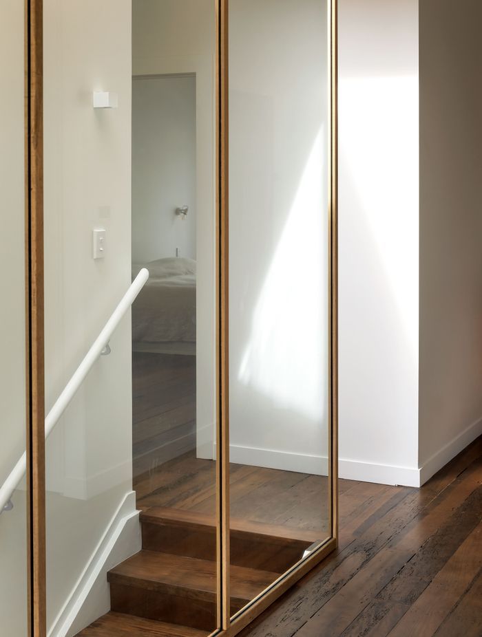 The stairwell skylight and glazing allow sunlight into the hallway. Photo: David Straight