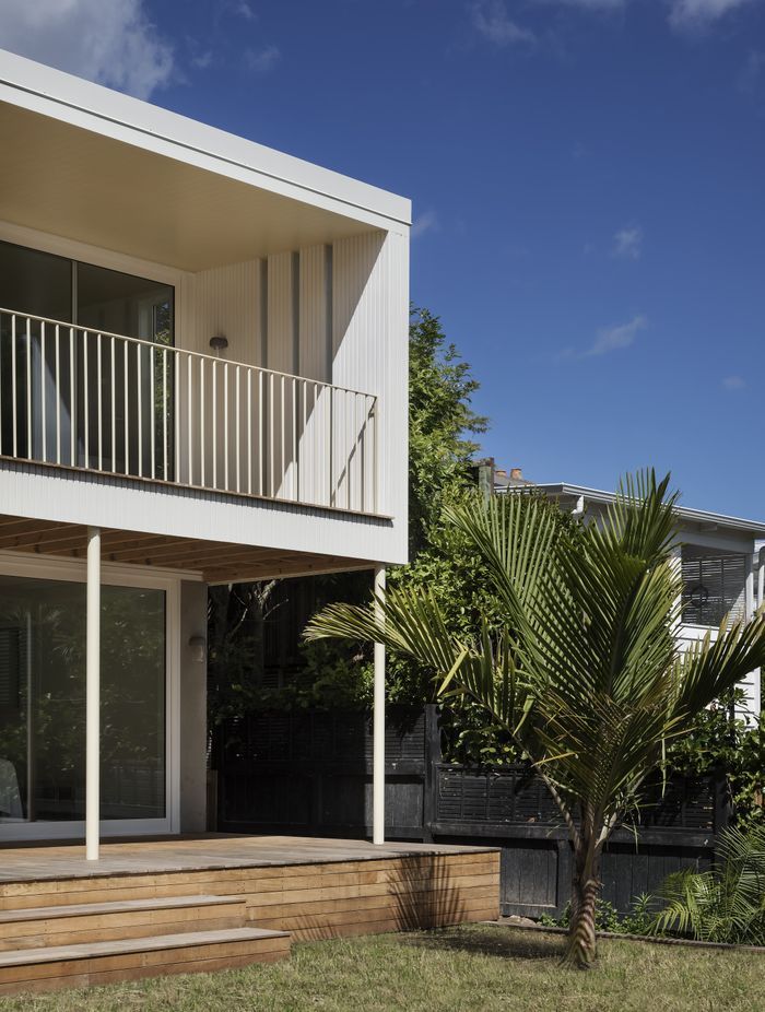 The villa renovation reimagined the back of the property, adding a covered balcony that looks out over the leafy streets of Grey Lynn. Photo: David Straight