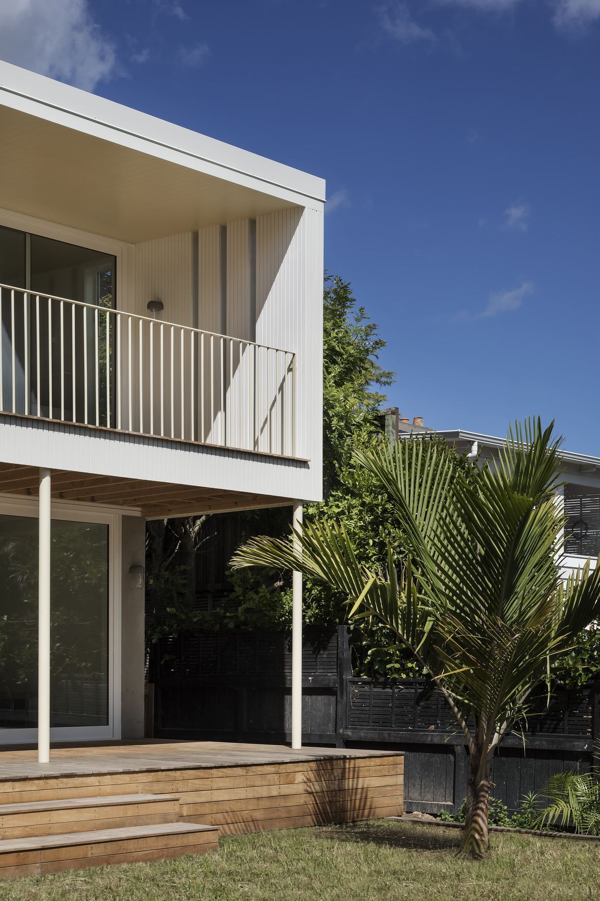 The villa renovation reimagined the back of the property, adding a covered balcony that looks out over the leafy streets of Grey Lynn. Photo: David Straight