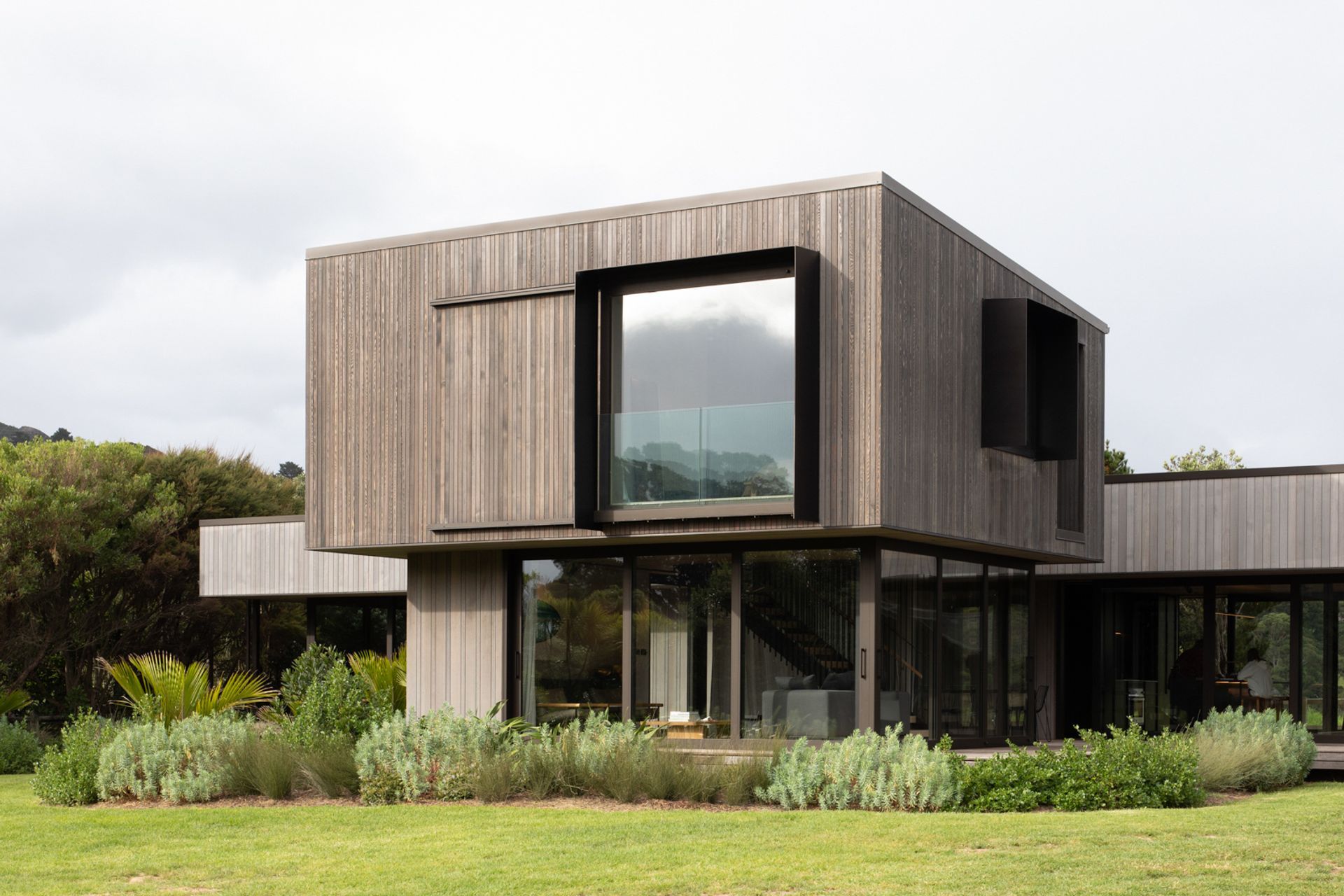The vertical form houses a living space on the ground floor, with the master suite above. Image credit: David Straight