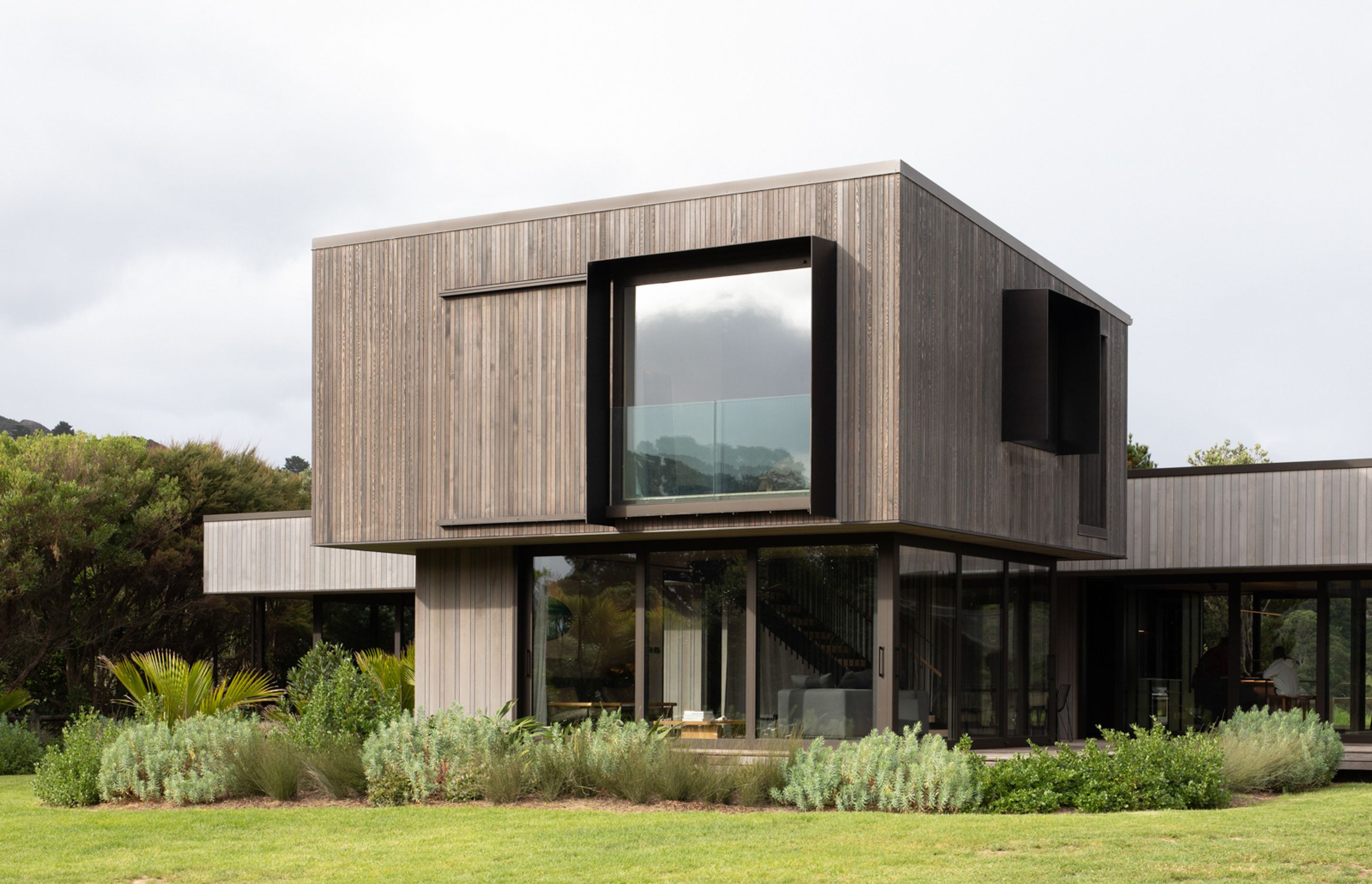 The vertical form houses a living space on the ground floor, with the master suite above. Image credit: David Straight