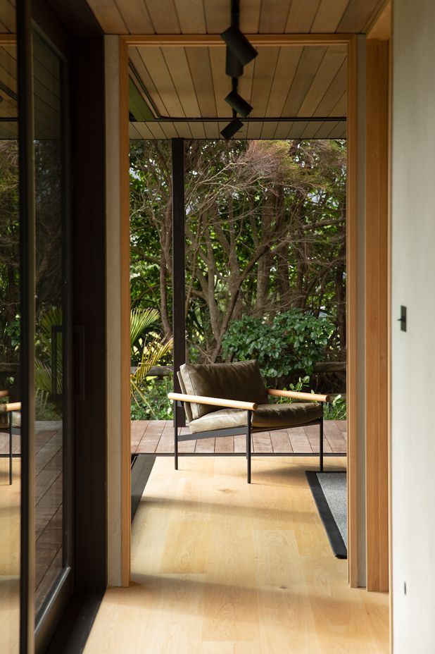 The guest room at the end of the bedroom spaces can be opened right up to the lush semi-tropical garden. Image credit: David Straight