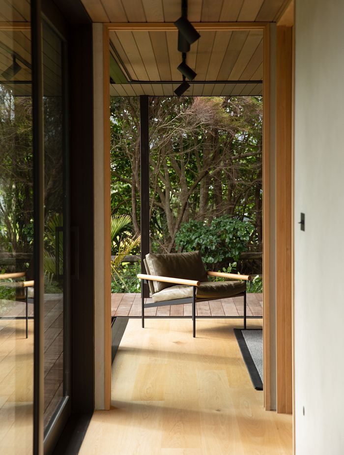 The guest room at the end of the bedroom spaces can be opened right up to the lush semi-tropical garden. Image credit: David Straight