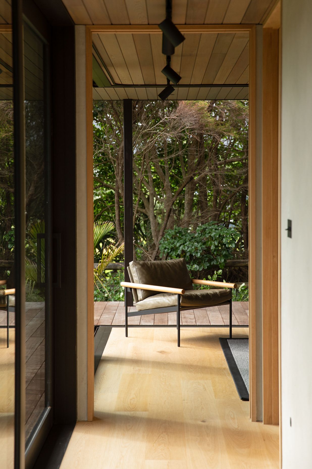 The guest room at the end of the bedroom spaces can be opened right up to the lush semi-tropical garden. Image credit: David Straight